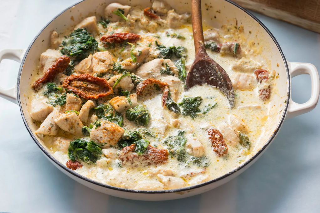 Creamy Healthy Tuscan Chicken in a Cast Iron Skillet with Parmesan Cheese